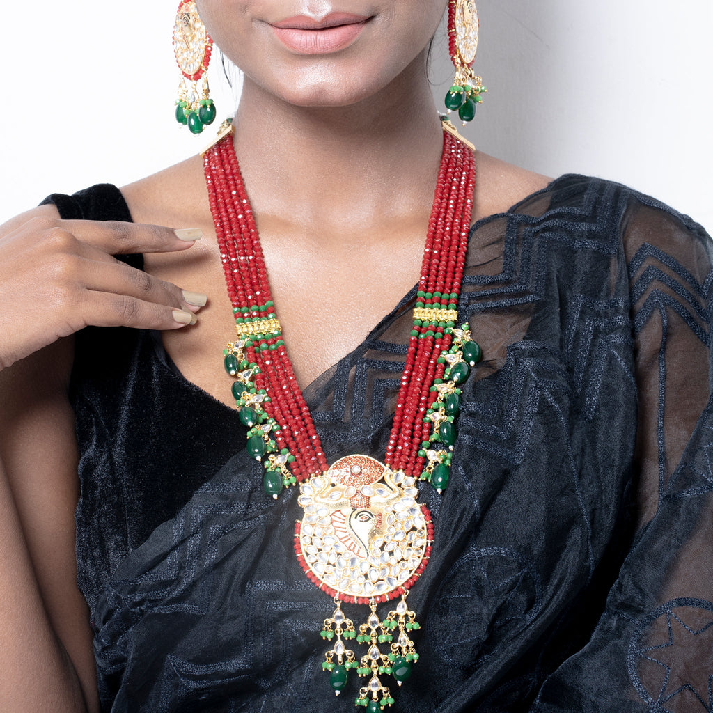 RED CRYSTAL NECKLACE SET WITH GOLDEN PENDANT AND MEENAKARI